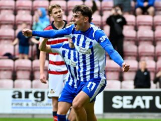 Γουίγκαν - Γουίκομ